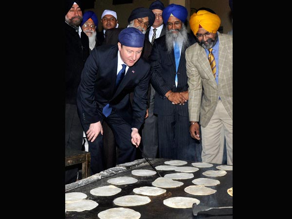 David Cameron baking chapattis at the Golden Temple