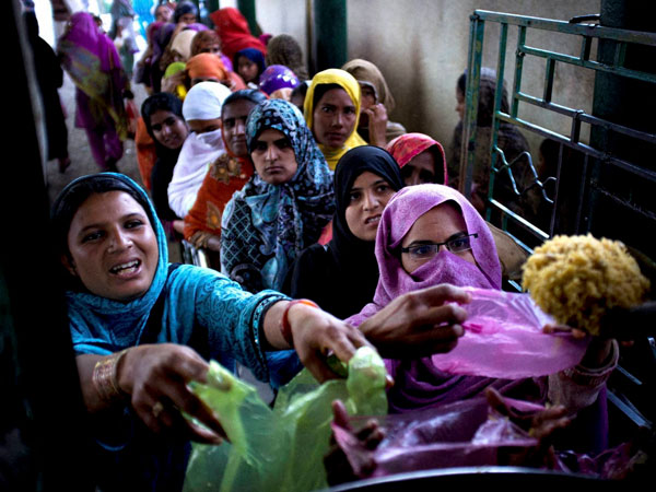 Women receive Charity food 