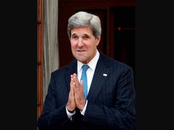 John Kerry greets