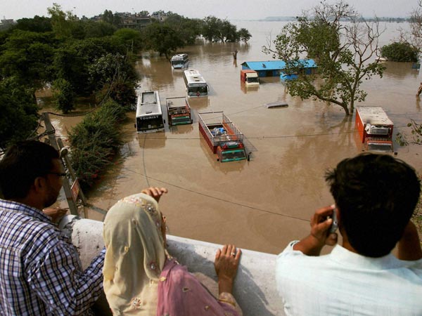 Vehicles in flooded ISBT locality near Yamuna River 