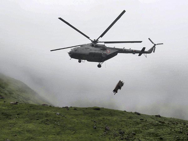 An IAF helicopter dropping wood for creamation