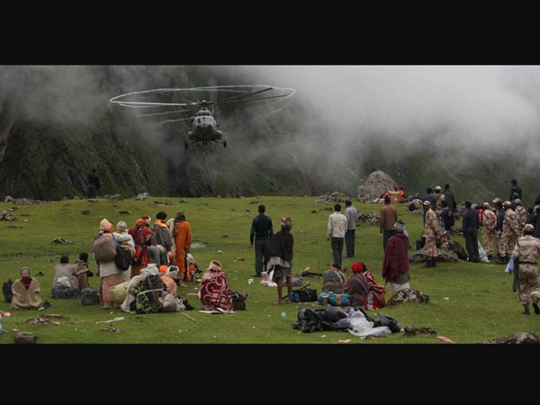 Sadhus wait to board an IAF helicopter