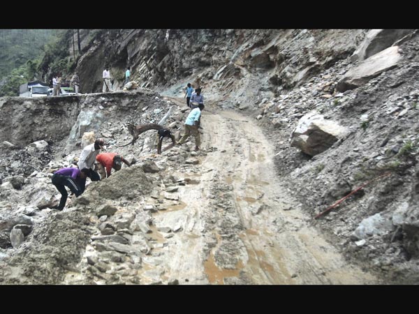 A damaged road caused by landslides in Gauchar