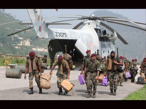 Army men unload relief material