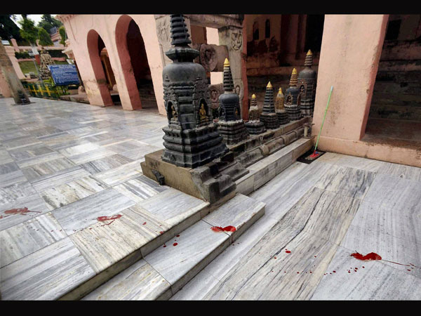 Blood lies splattered on the floor of the Mahabodhi Temple