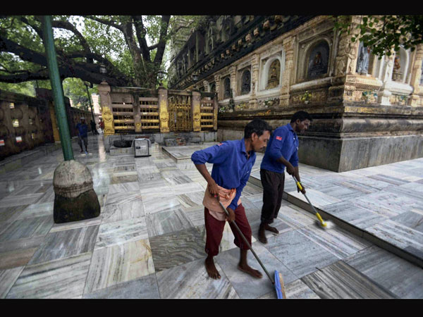 Workers clean the blasts site