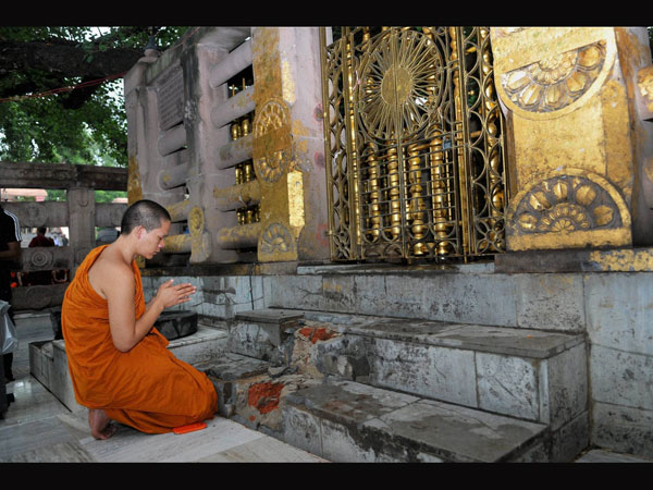 A Buddhist monk offers prayers for peace