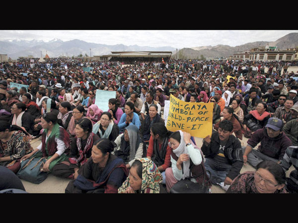 Buddhist devotees participate in a protest