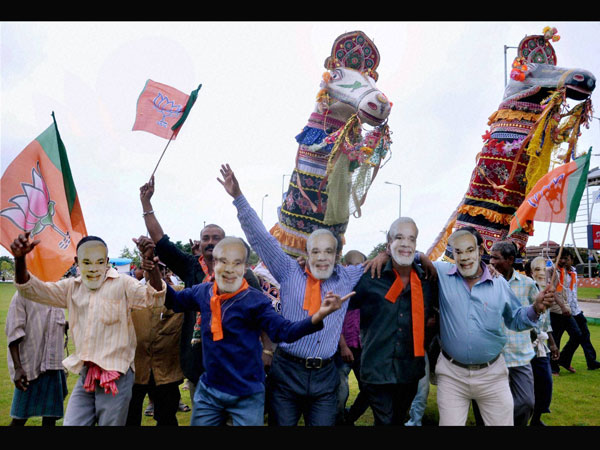 BJP supporters wear Modi mask