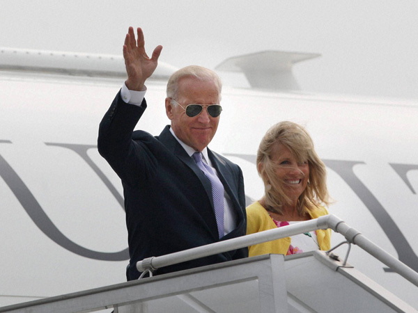 Joe Biden waves upon his arrival at AFS Palam