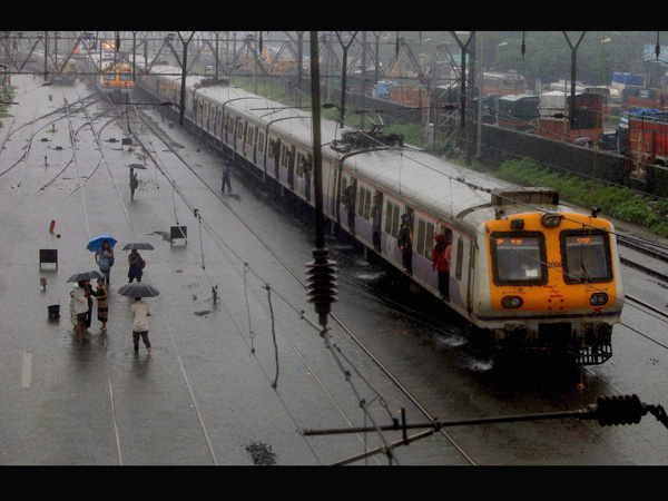 Mumbai local train on a water-logged rail track