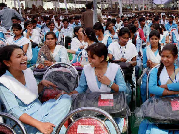 Students cheering with laptops