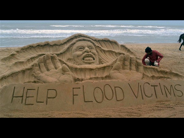 Sand art for flood victims