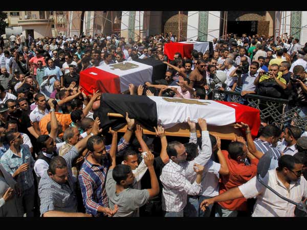 Egyptian relatives and colleagues of policemen