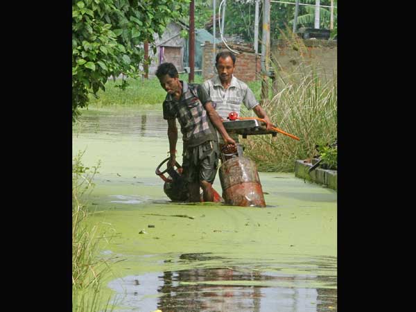 People shift base with belongings