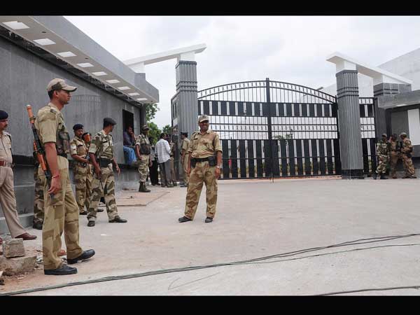 Men in khaki keep an eye for unruly elements