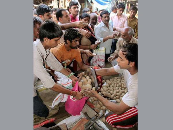 People come out to buy vegetables