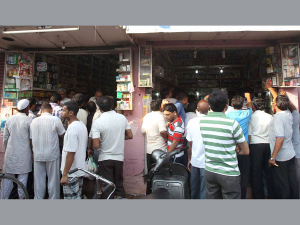 People buying medicines during the relaxed hours of curfew