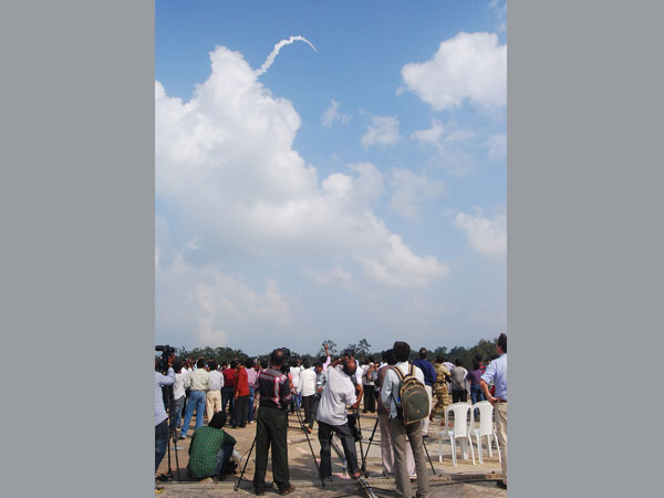 People watch from the ground