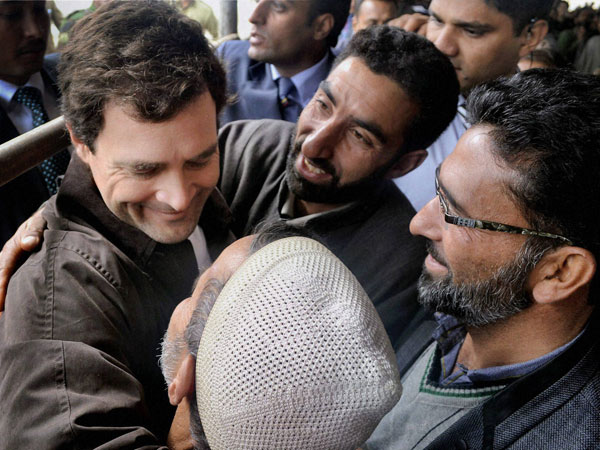 Rahul Gandhi hugs his supporters at the inauguration