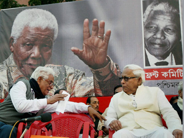 Former West Bengal Chief Minister Buddhadeb Bhattacharjee with CPI State Secretary Manju Kumar Majumdar(L) during condolence meeting of Former South African President Nelson Mandela in Kolkata on January 6.