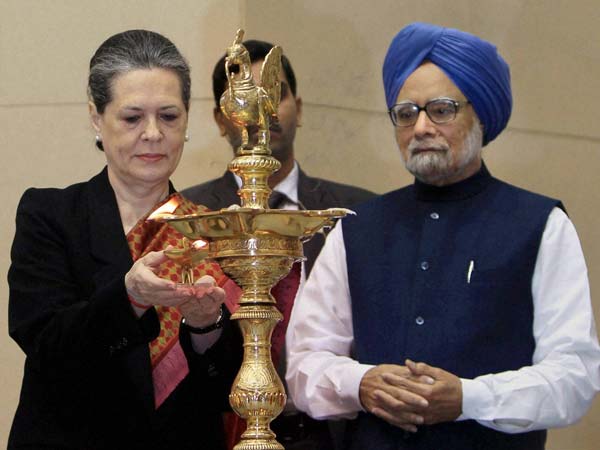 Prime Minister Manmohan Singh with UPA Chairperson Sonia Gandhi lighting the lamp