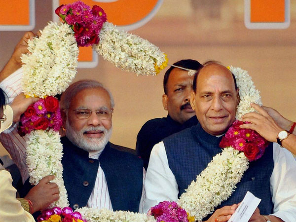 Modi and Rajnath Singh being garlanded