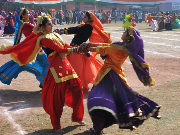 School students perform during a programme organised 