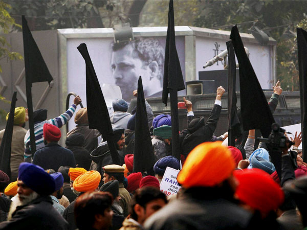 Sikhs waving black flag