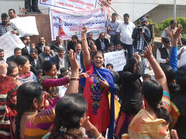 People protesting and raising slogans