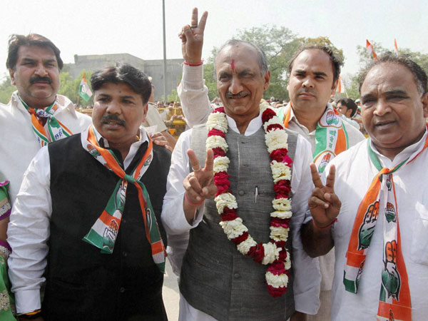 J P Agarwal flashes victory sign