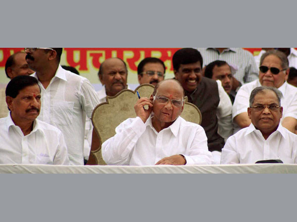 Sharad Pawar along with party leader Ganesh Naik