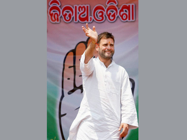 ahul Gandhi waves during an election rally