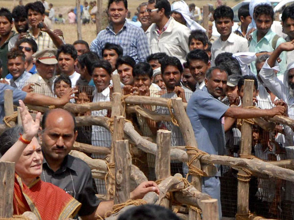 UPA Chairperson Sonia Gandhi waves to her party supporters