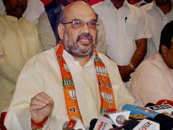 BJP leader Amit Shah addressing a press conference in Varanasi