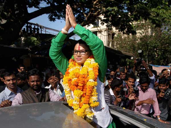 Rashtriya Aam Party leader Rakhi Sawant greets her supporters