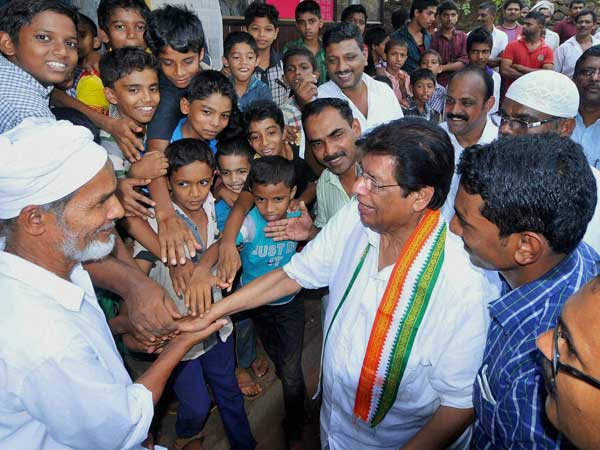 E. Ahamed interacts with public during an election campaign