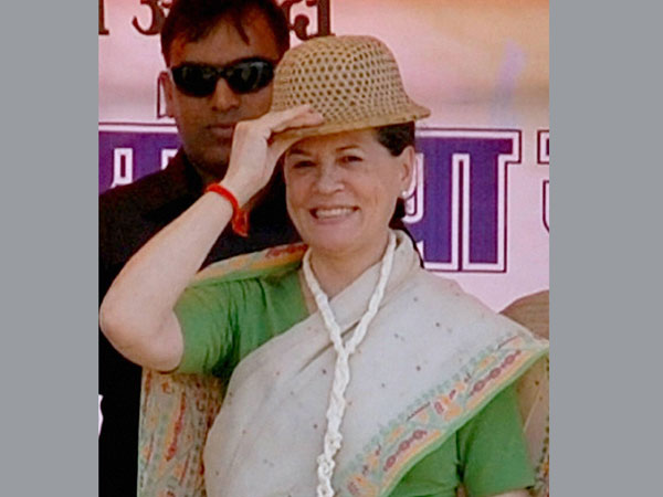 Sonia Gandhi wears a cap at an election rally in Sidhi