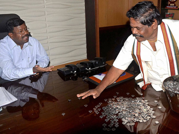 Kuppul G Devadoss deposits the fees in coins