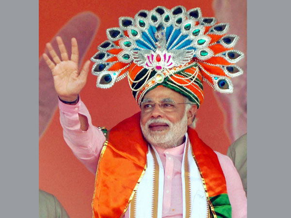 Narendra Modi waves to supporters