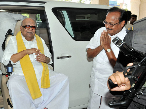 M Karunanidhi arrives at an election campaign ally in Coimbatore