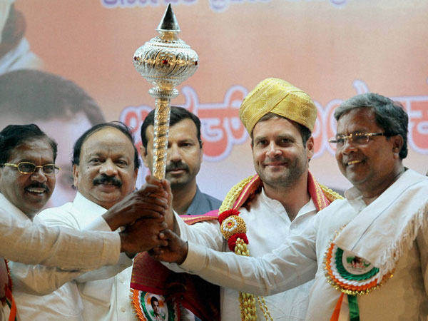 Rahul Gandhi wears a Mysore peta and holds a mace as Karnataka CM Siddaramaiah Rahul Gandhi wears a Mysore peta and holds a mace as Karnataka CM Siddaramaiah