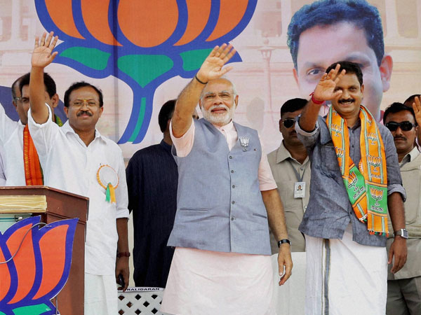 Narendra Modi waves after addressing the public meeting in Kasaragod Narendra Modi waves after addressing the public meeting in Kasaragod