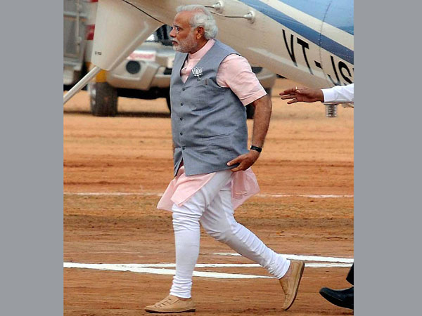 Narendra Modi arrives to address an election rally in Mysore