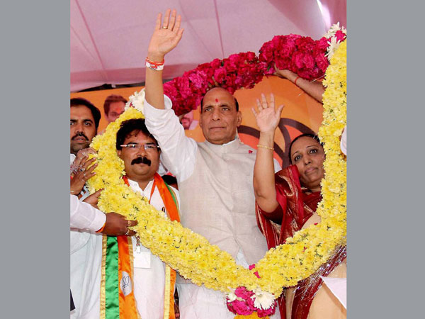 Rajnath Singh being garlanded at a public meeting in Latur