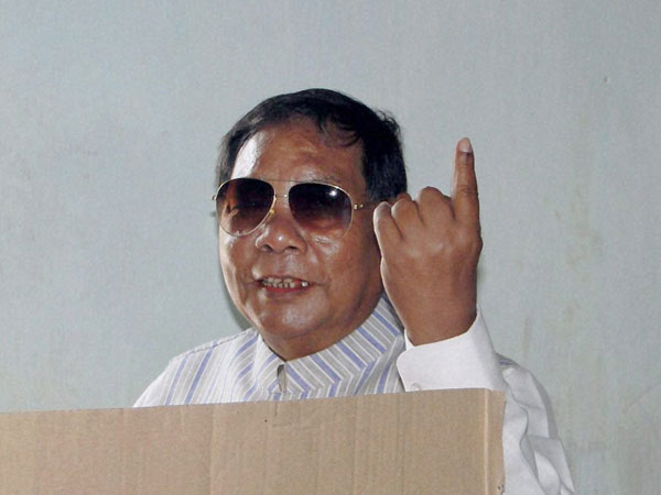 PA Sangma shows his ink-marked finger while casting his vote
