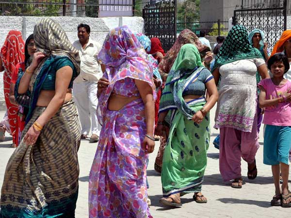 Voters arrive to cast their votes at a polling station Voters arrive to cast their votes at a polling station