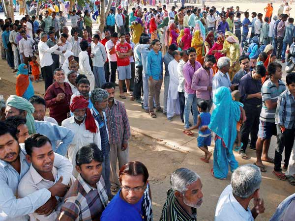 Voters stand in queues to cast their votes Voters stand in queues to cast their votes