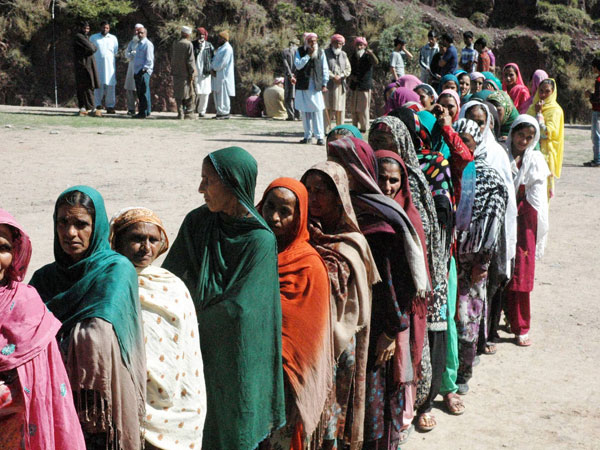 oters stand in queue to cast their votes oters stand in queue to cast their votes