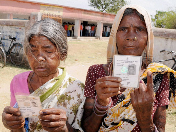 Women showing their ink-marked finger Women showing their ink-marked finger